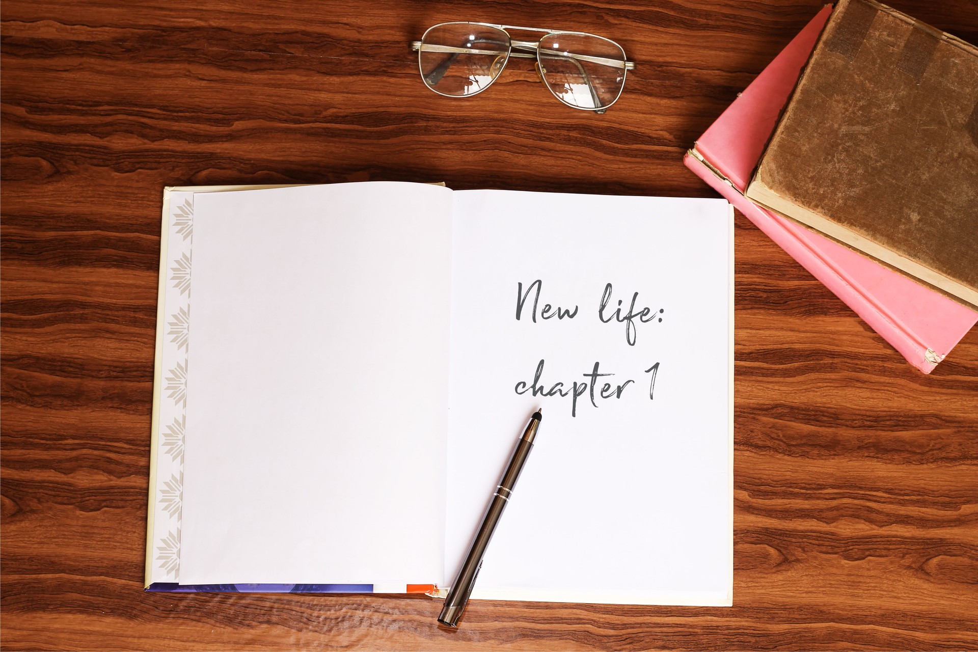 New life: chapter 1 on open book on wooden table